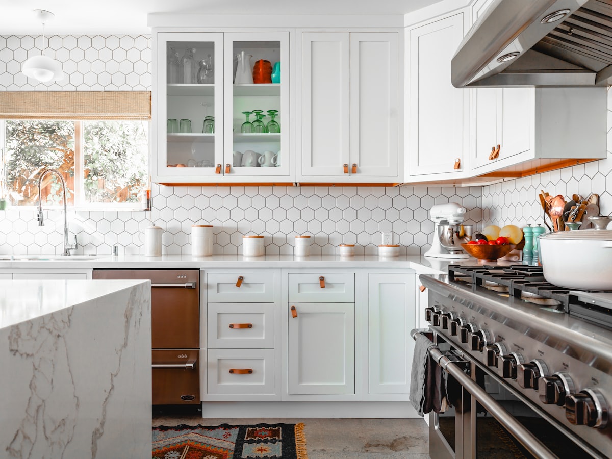 Kitchen with a visible work triangle and clear floor in front of cabinets