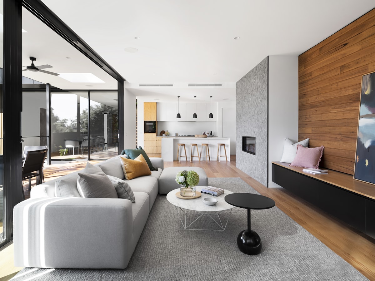 Modern living room with a low sofa, simple coffee table, and uncluttered floor